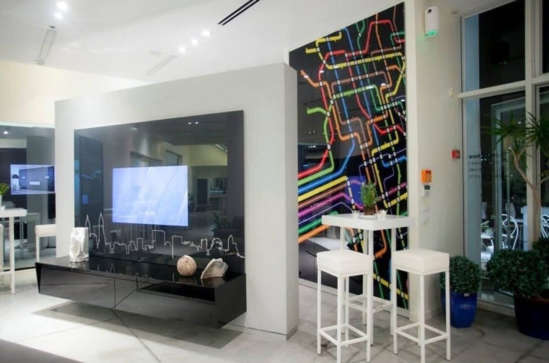 A colorful artwork installed in a designer apartment.